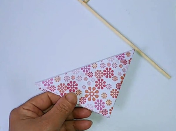 Illustration of steps on how to make a childhood toy paper pinwheel