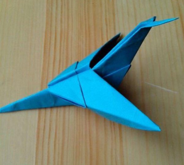 Illustration of steps for folding a swallow paper airplane