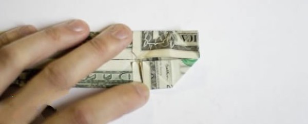 How to fold one dollar origami with two hearts. Illustrated tutorial on folding two hearts with money.