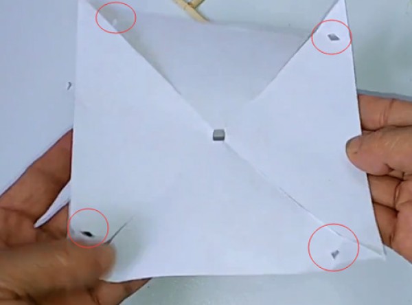 Illustration of the steps for making a childhood toy paper pinwheel