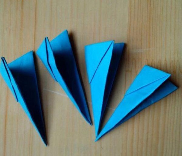 Illustration of the steps for folding a swallow paper airplane