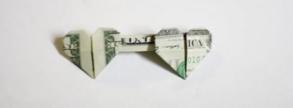 How to fold one dollar origami with two hearts. Illustrated tutorial on folding two hearts with money.