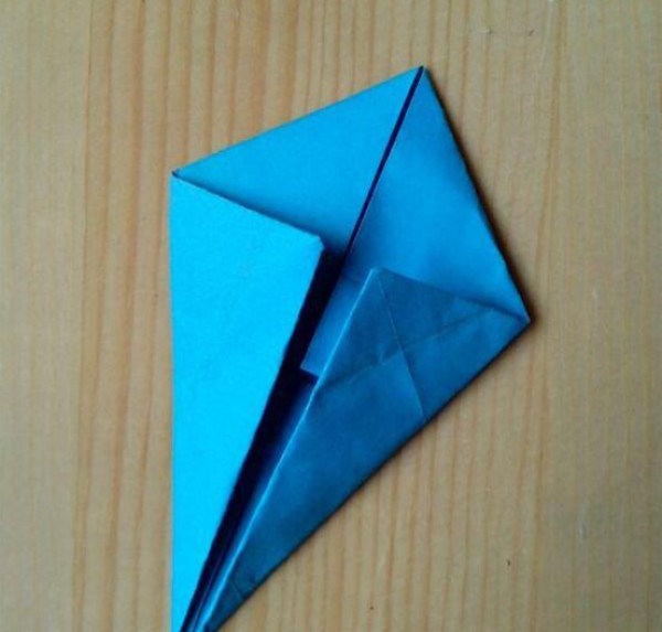 Illustration of the steps for folding a swallow paper airplane