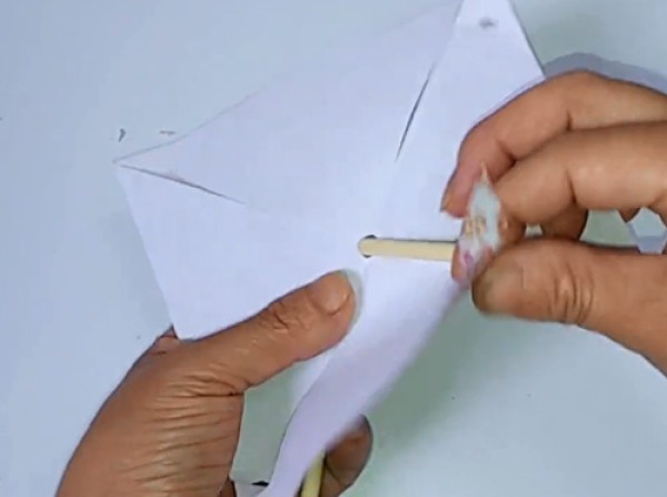 Illustration of steps on how to make a childhood toy paper pinwheel