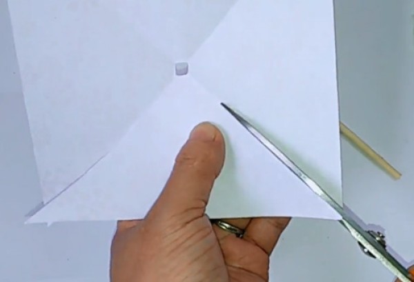 Illustration of steps on how to make a childhood toy paper pinwheel