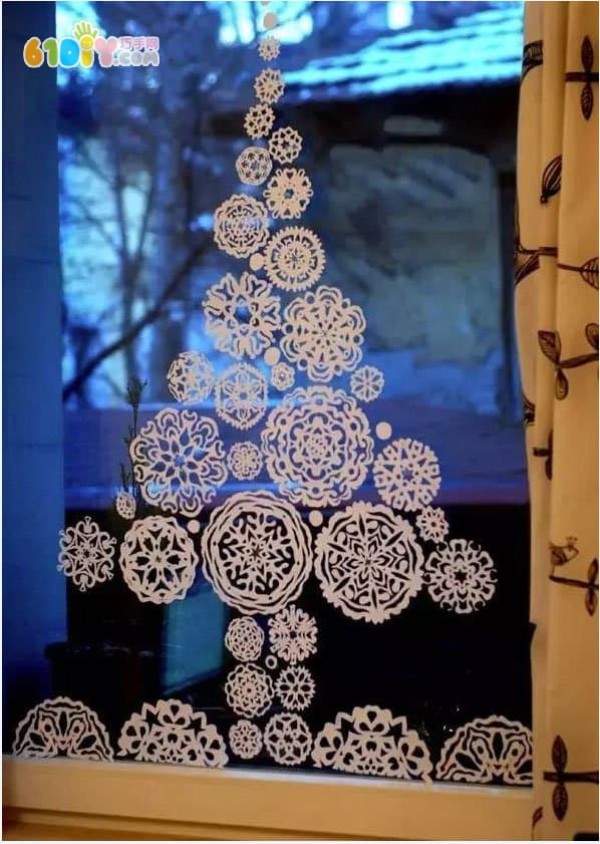 Beautiful Christmas window decorations Paper cut snowflake Christmas tree