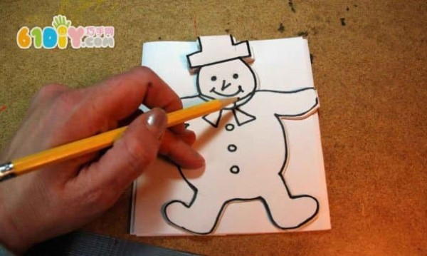 Children make beautiful paper-cut snowmen by hand in winter