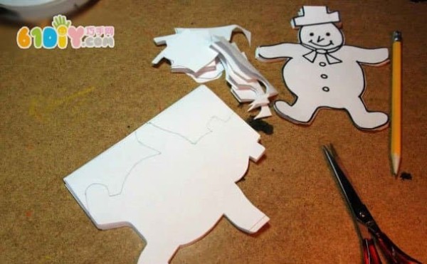 Children make beautiful paper-cut snowmen by hand in winter