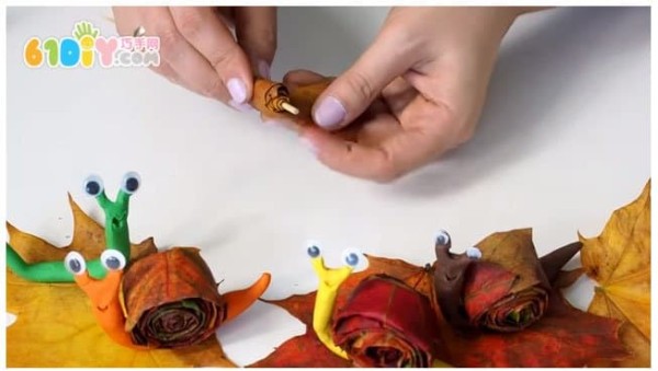 Childrens handmade leaf clay snails