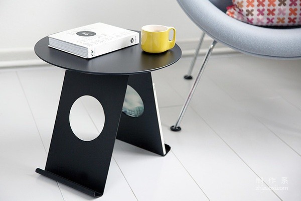 Simple and stylish small table that can hold magazines