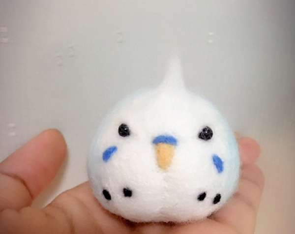 Cute handmade wool felt parrot that looks like a glutinous rice dumpling