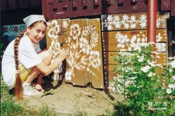 Plant flowers all over the wall, and accidentally the village becomes a fairy tale