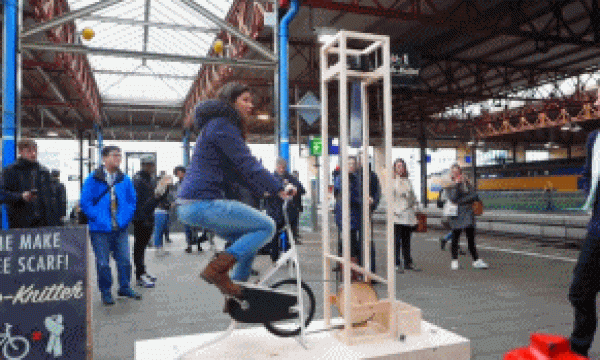 Handsome Dutch boy invents waiting tool and knits scarf while waiting