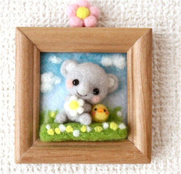 Various cute three-dimensional handmade photo frames of small animals made of wool felt