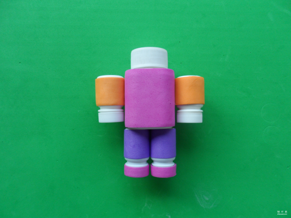 Isn’t this little robot cute? Cute childrens toy robot made from discarded pill bottles and colorful sponge paper