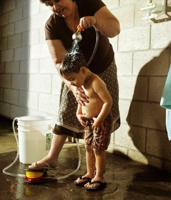 Portable foot-operated shower head