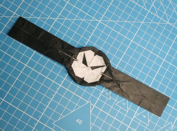 Universal origami, creative origami watch origami method, simple origami watch illustrative tutorial.