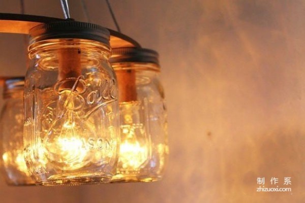 Using waste glass jars to create romantic Christmas lamps