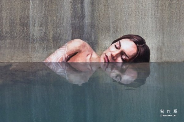 An American painter hand-painted a beautiful woman taking a bath on the exterior wall of an abandoned building