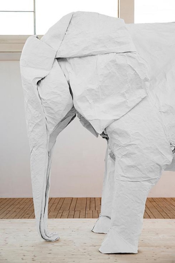 Talented artist Sipho Mabona folds a life-size elephant from a piece of white paper