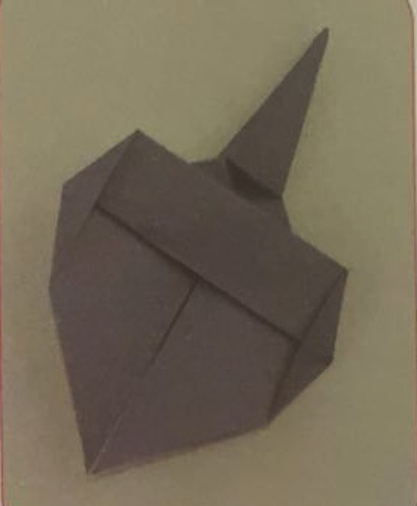 Illustration of steps for children to make handmade beetle origami