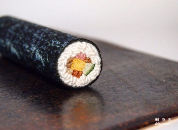 Using needles and threads instead of paintbrushes to embroider traditional Japanese delicacies