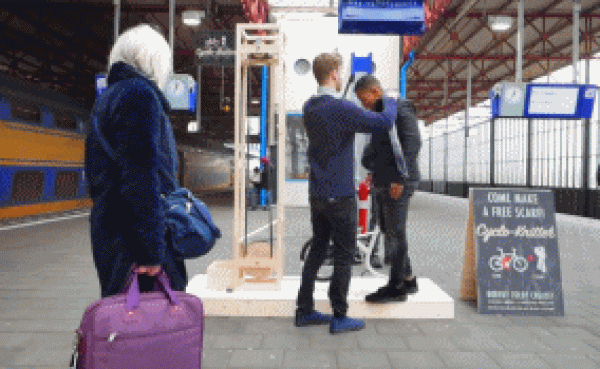 Handsome Dutch boy invents waiting tool and knits scarf while waiting