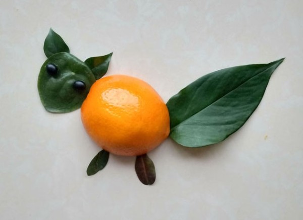 DIY cute little squirrel collage method with oranges and leaves