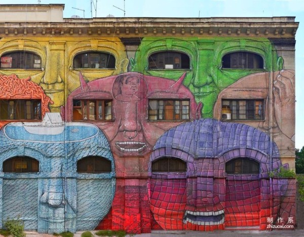 Colorful face mural art on the streets of Rome