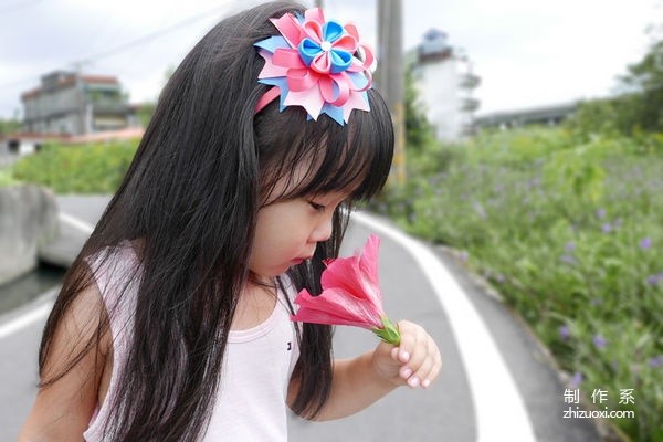 Hand-made beautiful head flowers with ribbons, layers of stacked ribbons and flowers, hairbands, hairpins, and hair accessories.