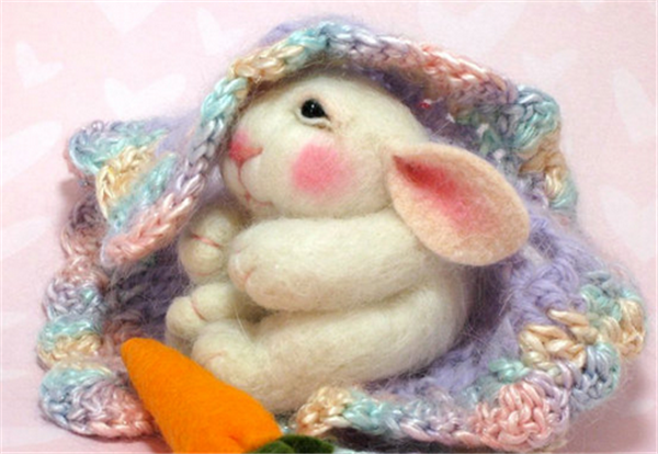 Adorable sleeping bunny made of handmade wool felt