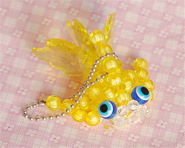 Small goldfish in various colors made by creative hand-beaded DIY