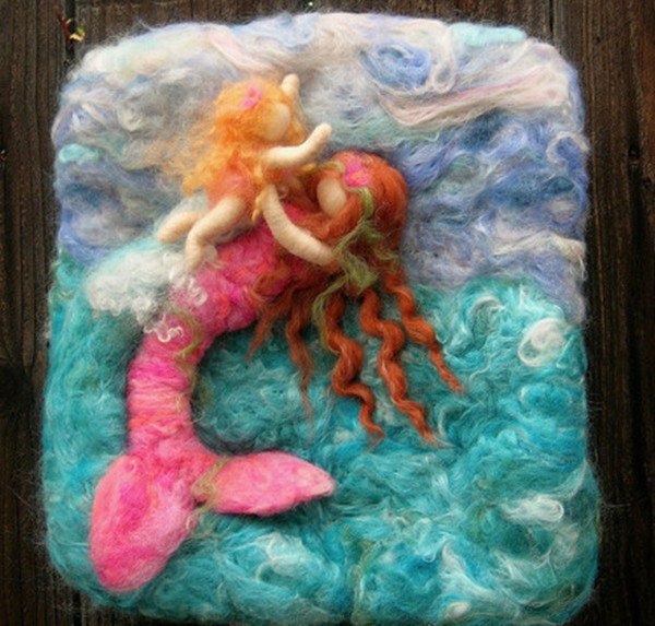 DIY mermaid made from wool felt happily playing at the bottom of the sea