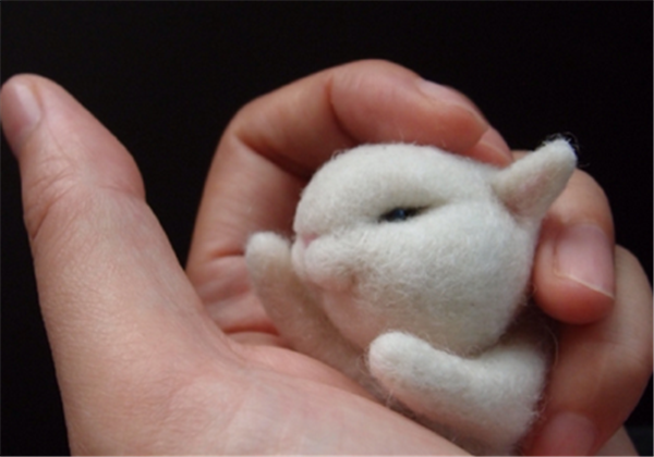 Cute pocket handmade wool felt DIY little white rabbit that can be held in the palm of your hand