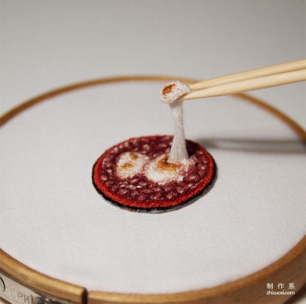 Using needles and threads instead of paintbrushes to embroider traditional Japanese delicacies