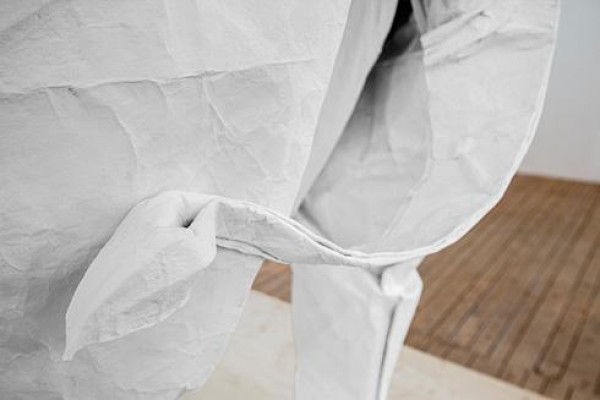 Talented artist Sipho Mabona folds a life-size elephant from a piece of white paper