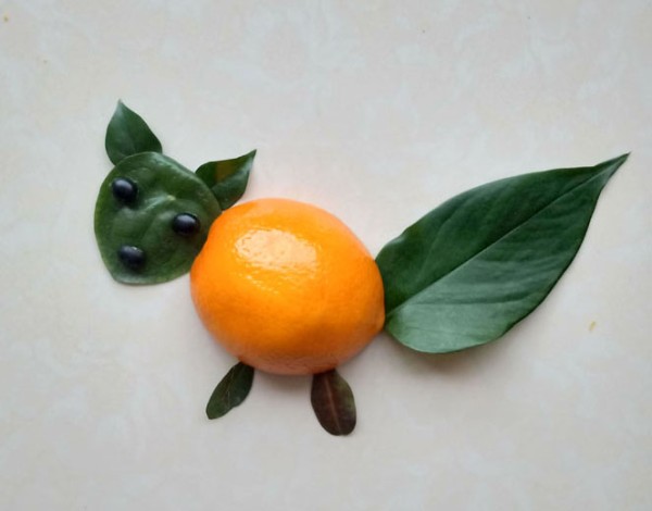 DIY cute little squirrel collage method with oranges and leaves