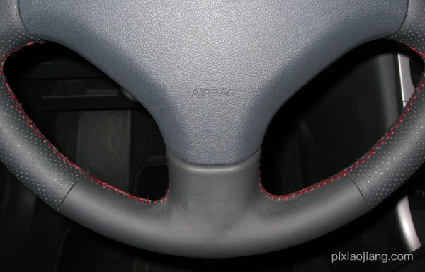 Hand-stitched steering wheel cover