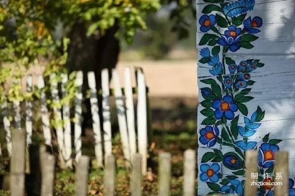 Plant flowers all over the wall, and accidentally the village becomes a fairy tale