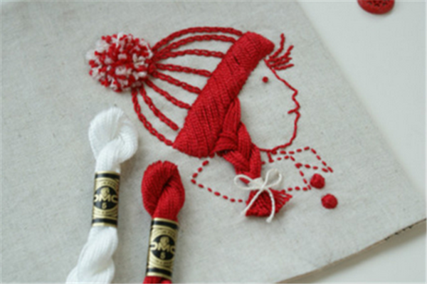 A little girl with braids, artistic and fresh hand embroidery made by DIY