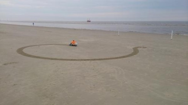 BeachBot: a mechanical sea turtle that makes giant sand paintings