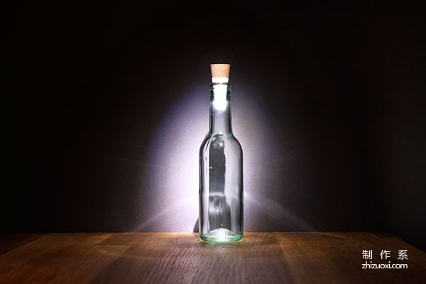 Cork caps that turn empty bottles into practical desk lamps