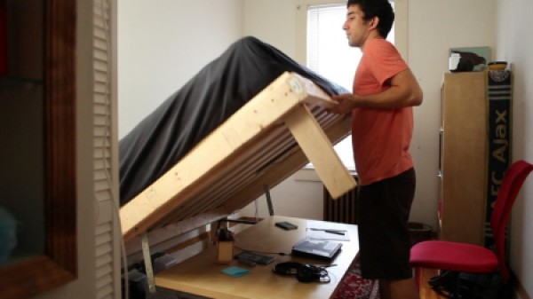 Space-saving folding bed and table