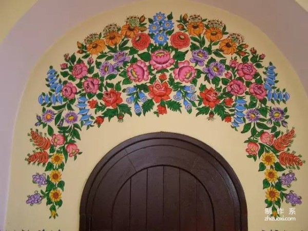 Plant flowers all over the wall, and accidentally the village becomes a fairy tale