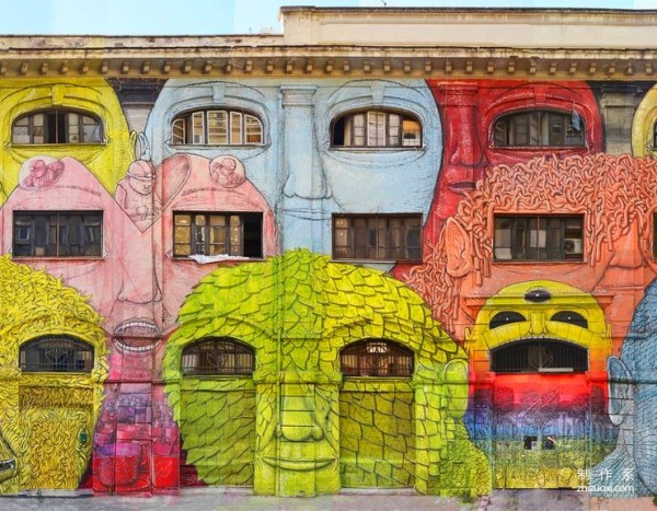 Colorful face mural art on the streets of Rome