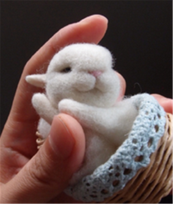 Cute pocket handmade wool felt DIY little white rabbit that can be held in the palm of your hand