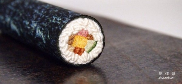 Using needles and threads instead of paintbrushes to embroider traditional Japanese delicacies