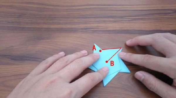 Fun origami for children. Teach children to fold a simple five-pointed star.