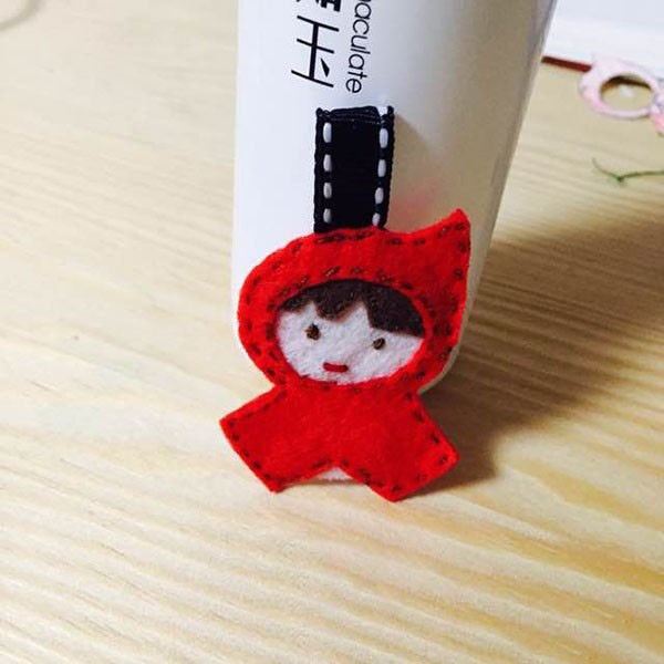 The brave little hero’s cute little red riding hood is made into a keychain