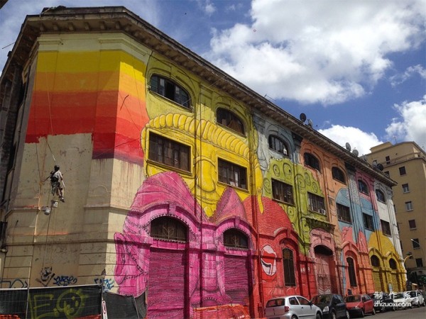 Colorful face mural art on the streets of Rome